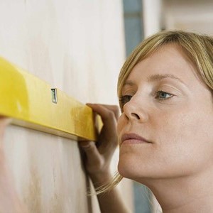 women using a level square